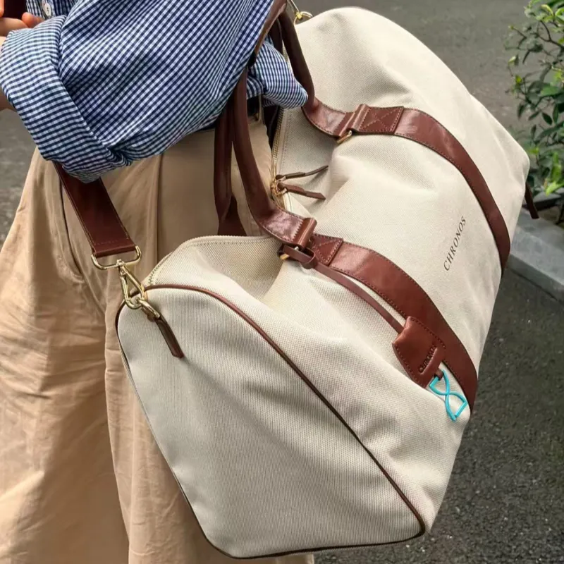 客户拓展轻便帆布旅行包 Customer expansion product with light canvas body, leather trim and detachable shoulder strap